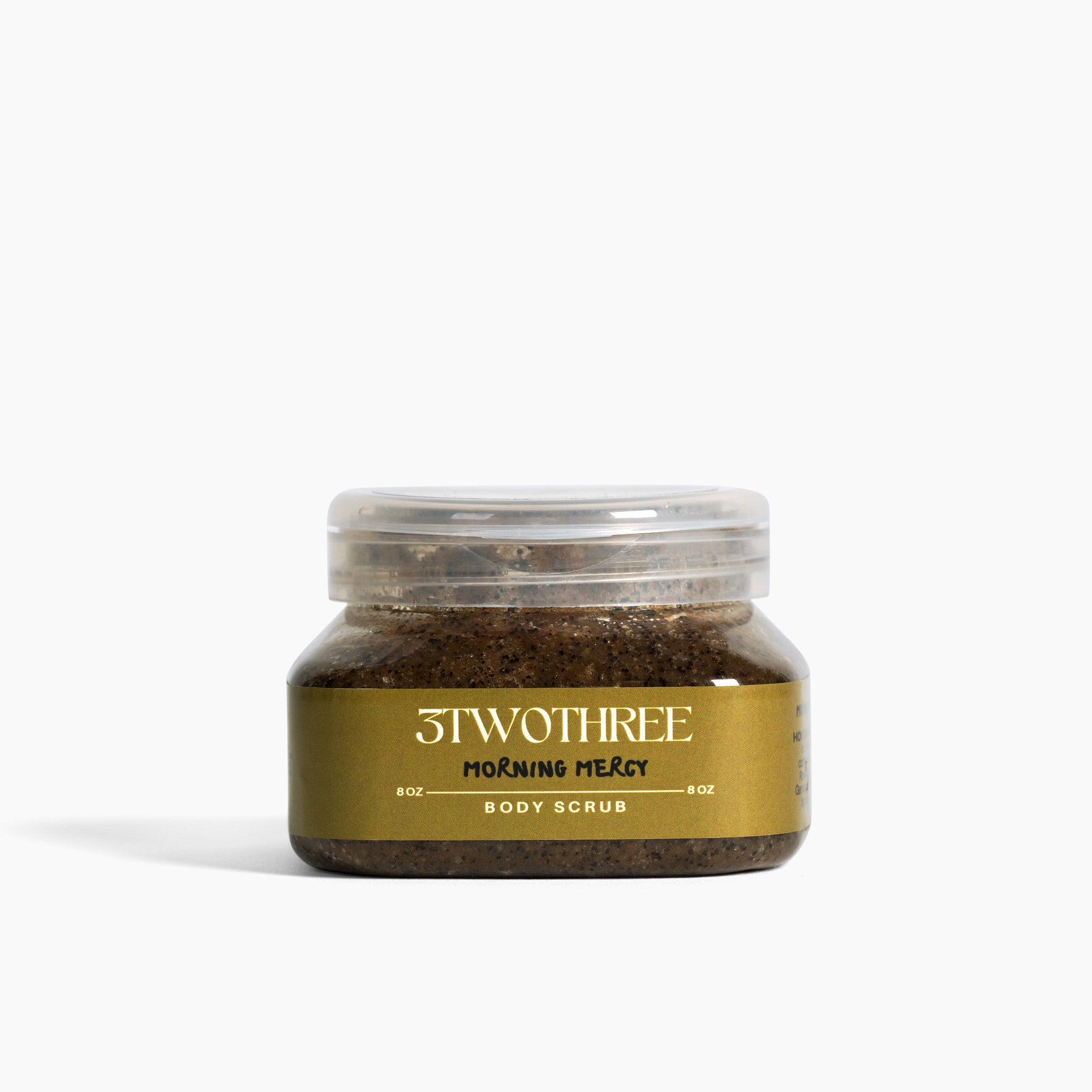 Square jar of Morning Mercy body scrub with '3TWOTHREE' branding on a white background